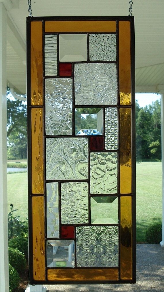 Stained glass window panel with ambers