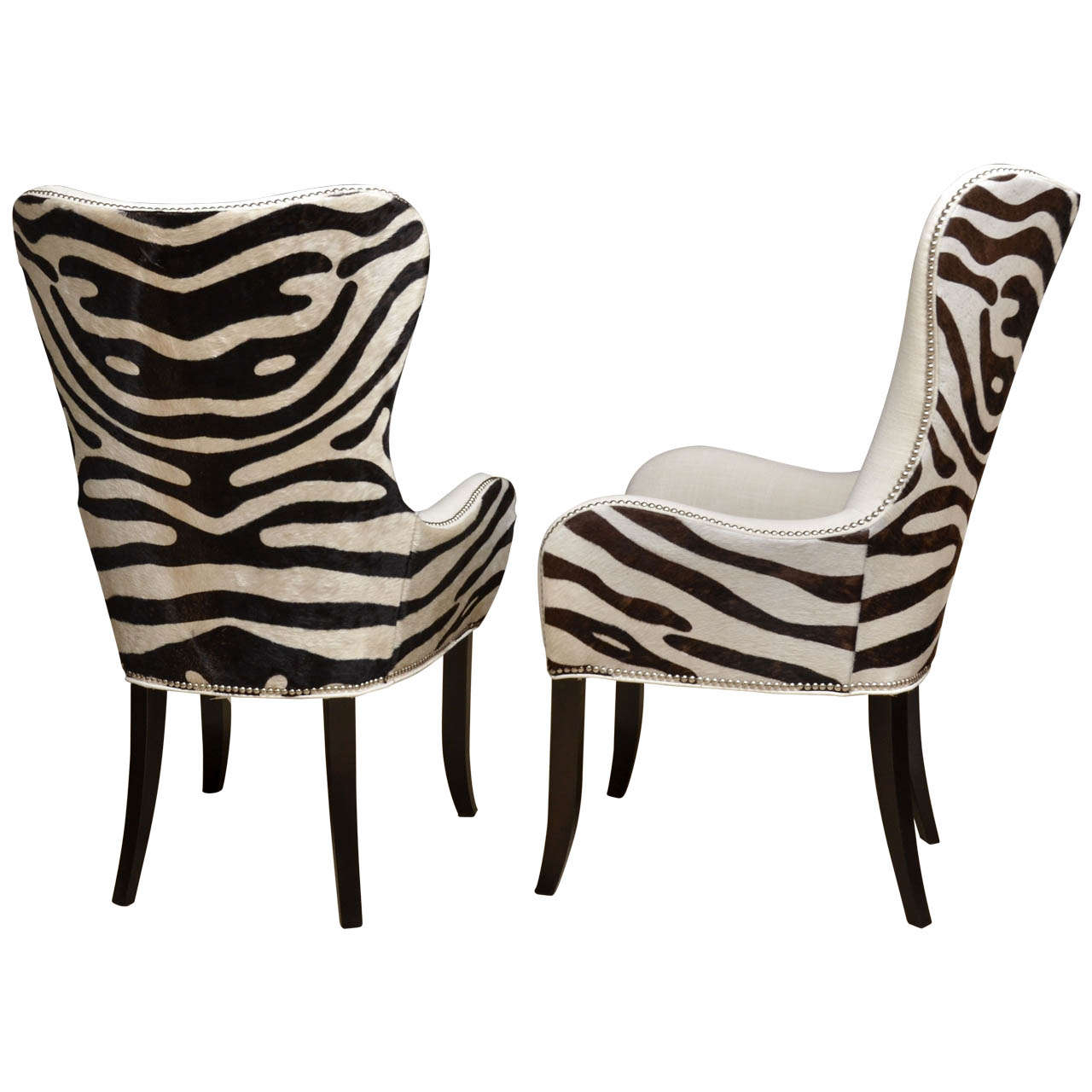 Pair of cowhide stenciled zebra arm chairs