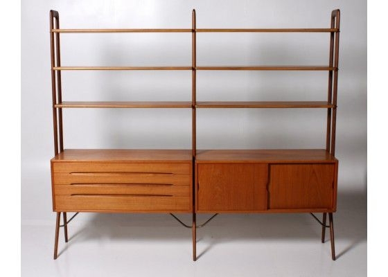 Behind the couch bookshelf