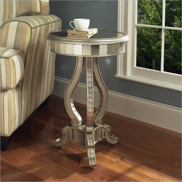 Hand painted silver mirrored accent pedestal table add unique style