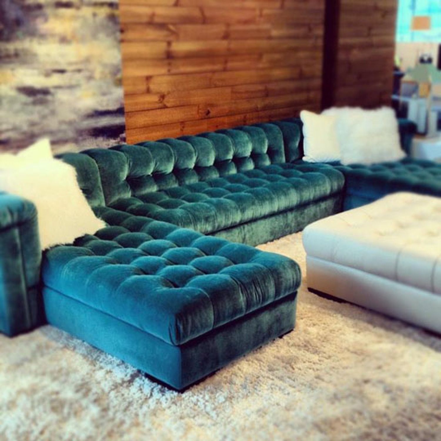 Teal tufted sofa