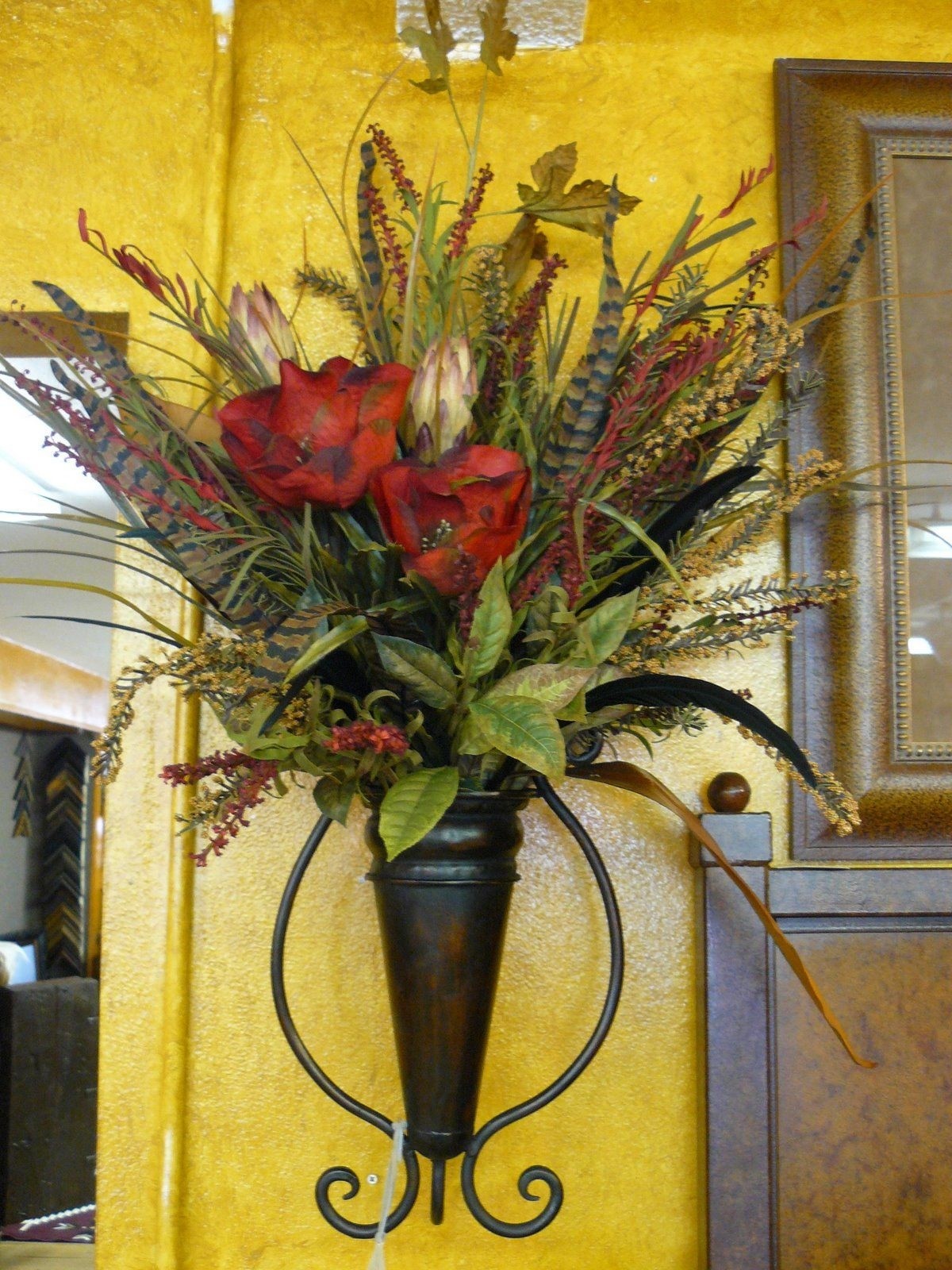 Wall scones with floral arrangement holly what about this very