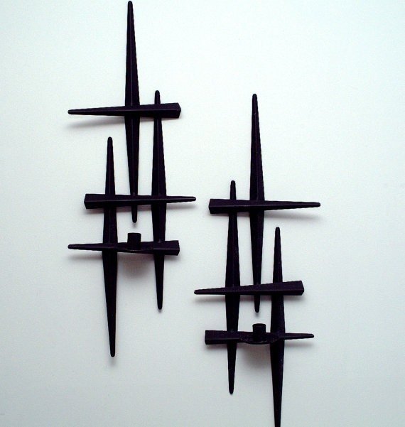 A pair of vintage brutalist cast iron