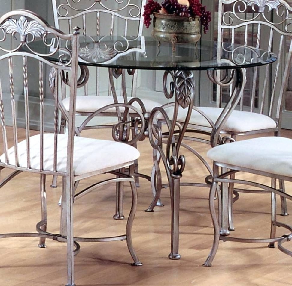 Glass top dining table with metal base