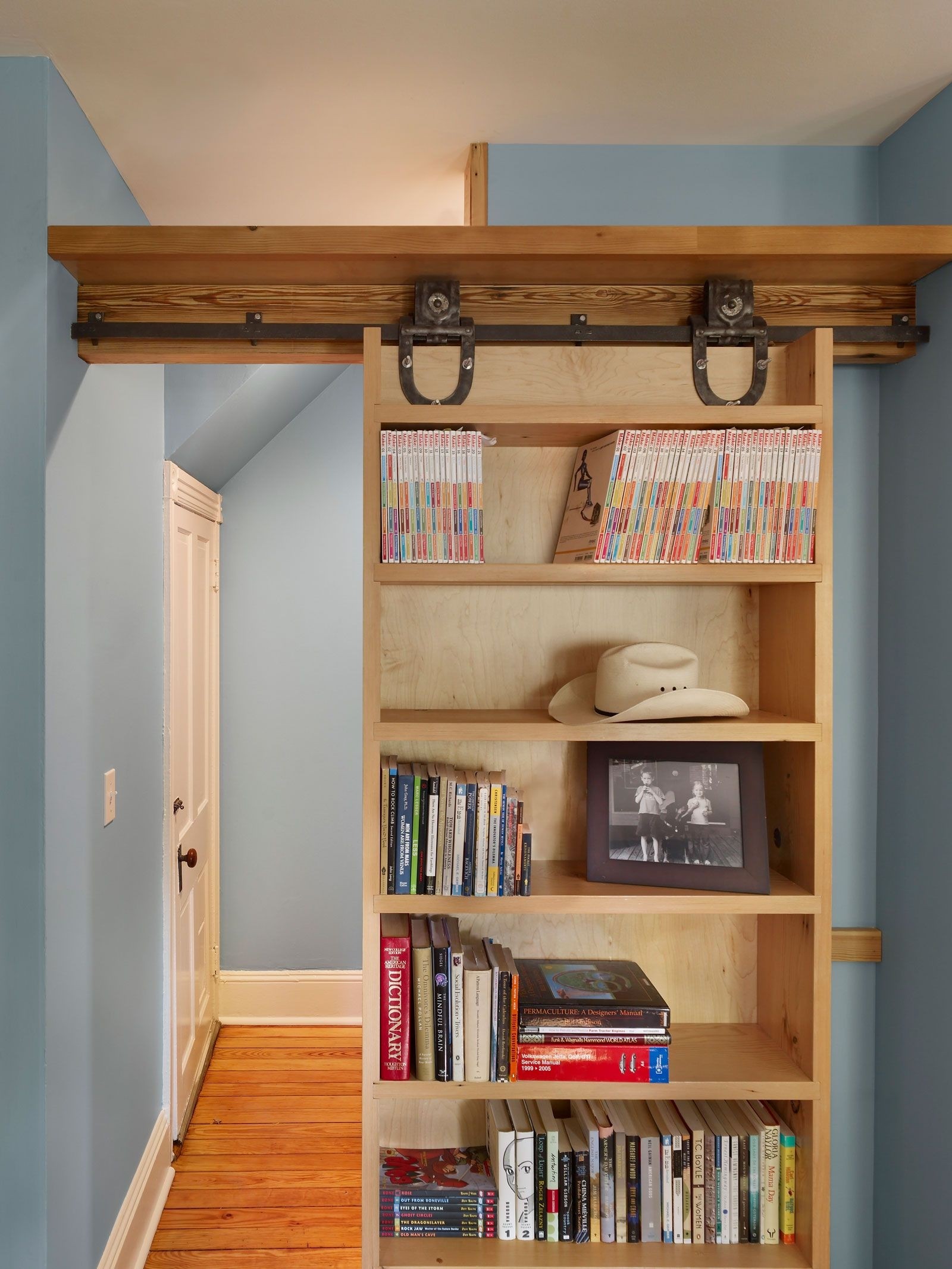 Sliding bookshelf door