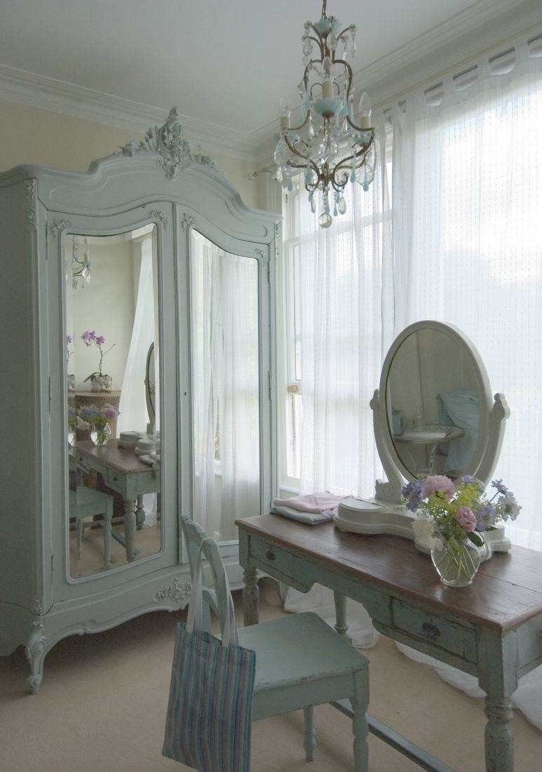 White armoire with mirrored door