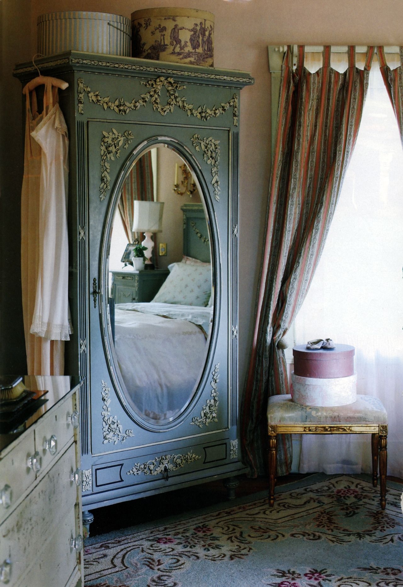White wardrobe with drawers and mirror