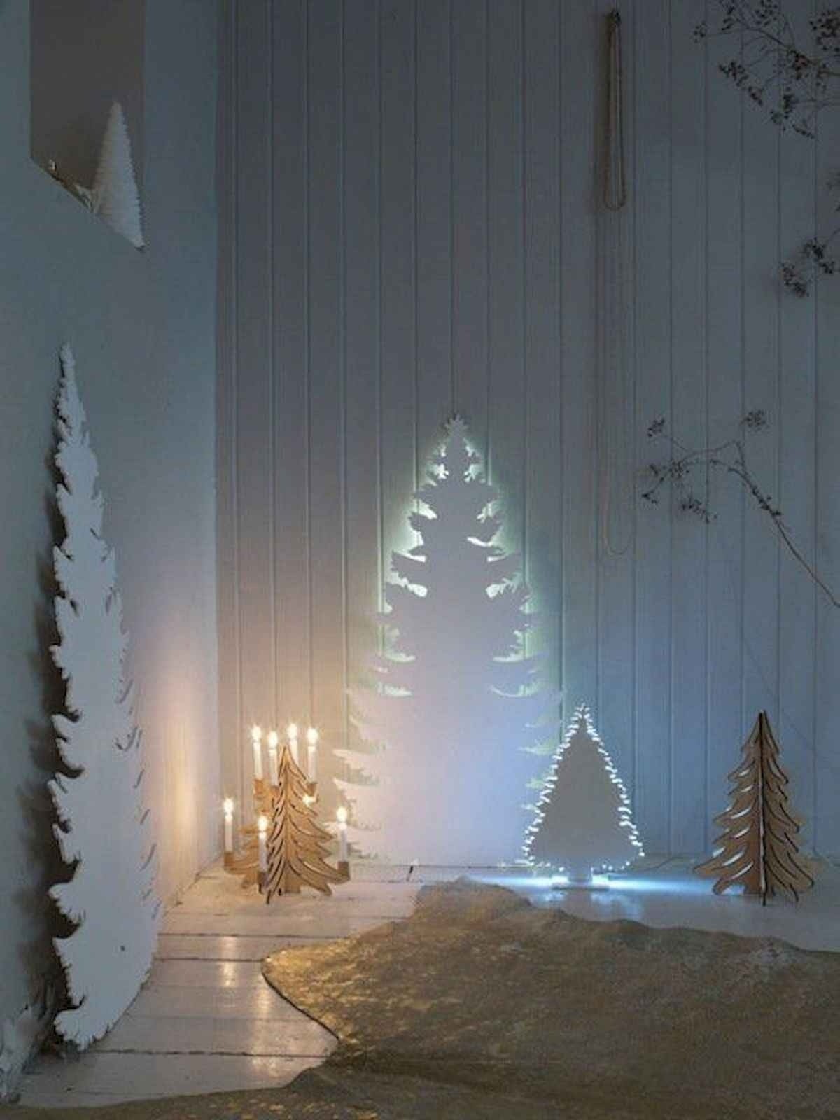 Christmas tree made out of lights on wall