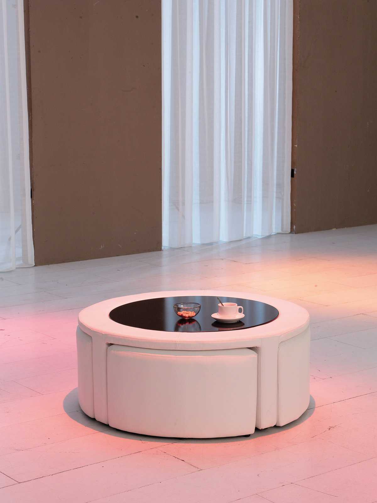 Coffee table with pull out ottomans