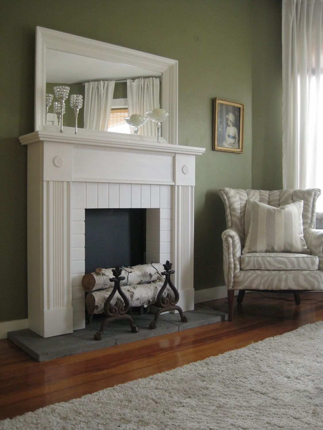 Elegant White Faux Fireplace with Classic Decor