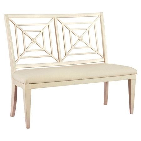 Upholstered bench with a latticework back and hand applied finish