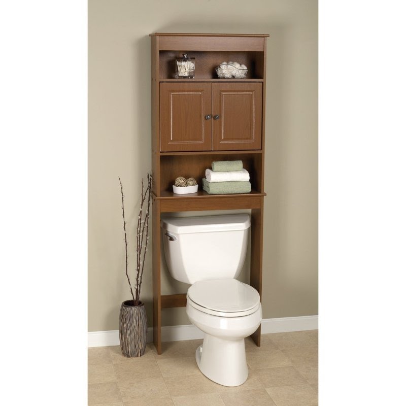 Behind the toilet stand
