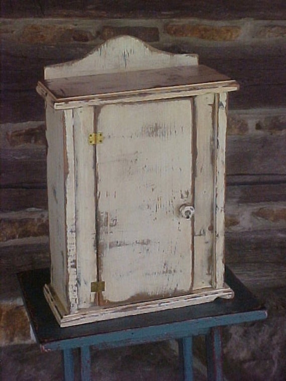Distressed wood cabinet white paint