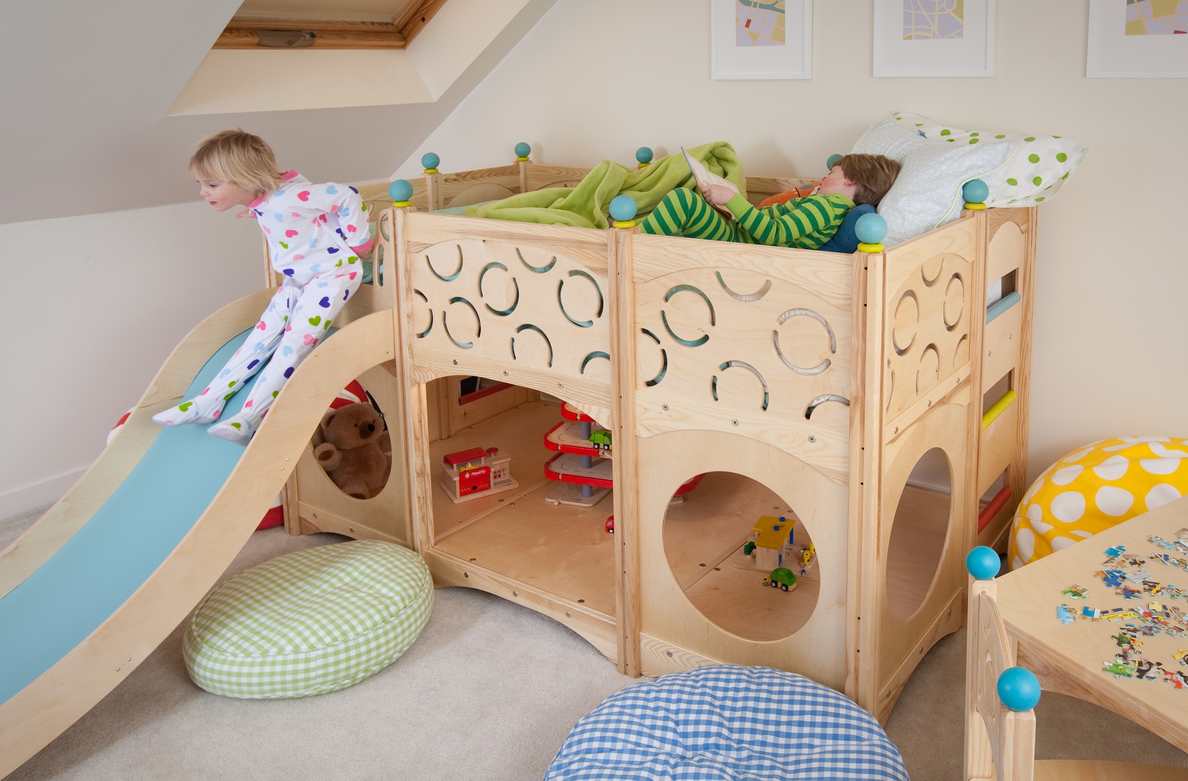 Wooden playhouse on stilts with slide