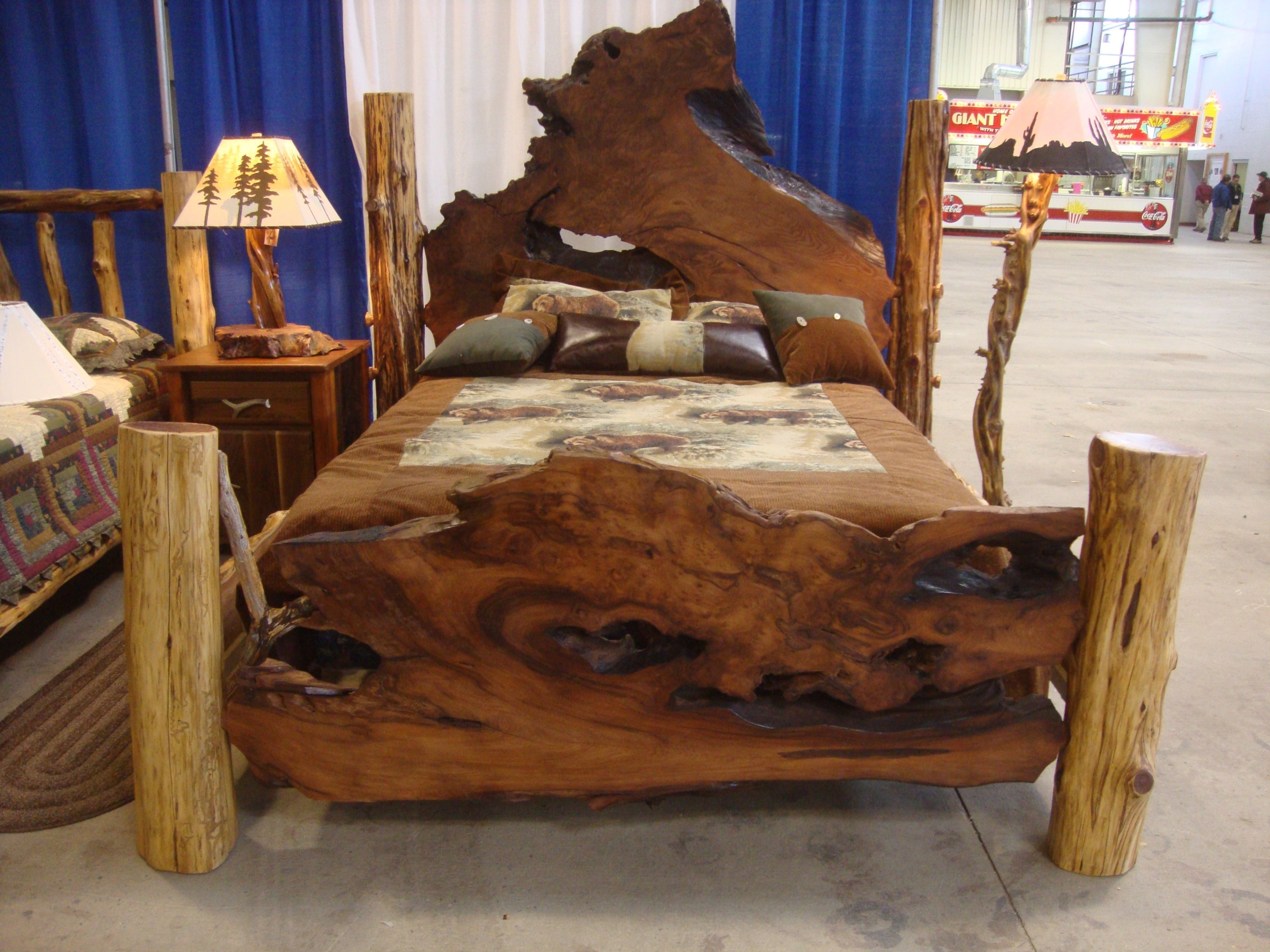 Redwood burl slab supported by a simple metal base burl