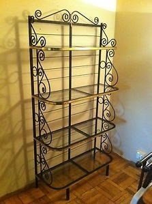 Free standing black wrought iron glass shelving unit bakers rack