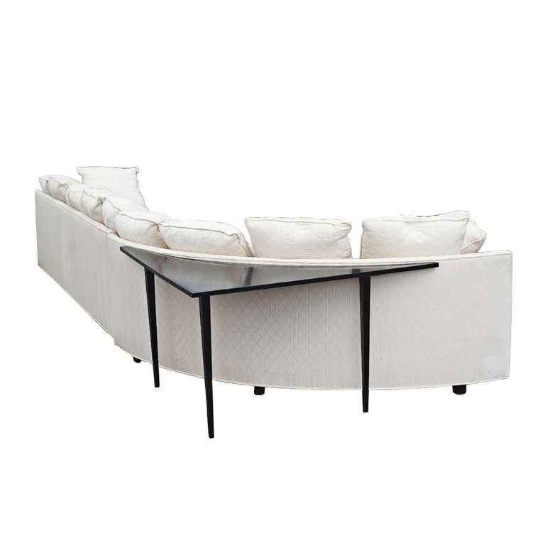Large two piece white sectional sofa with corner table image