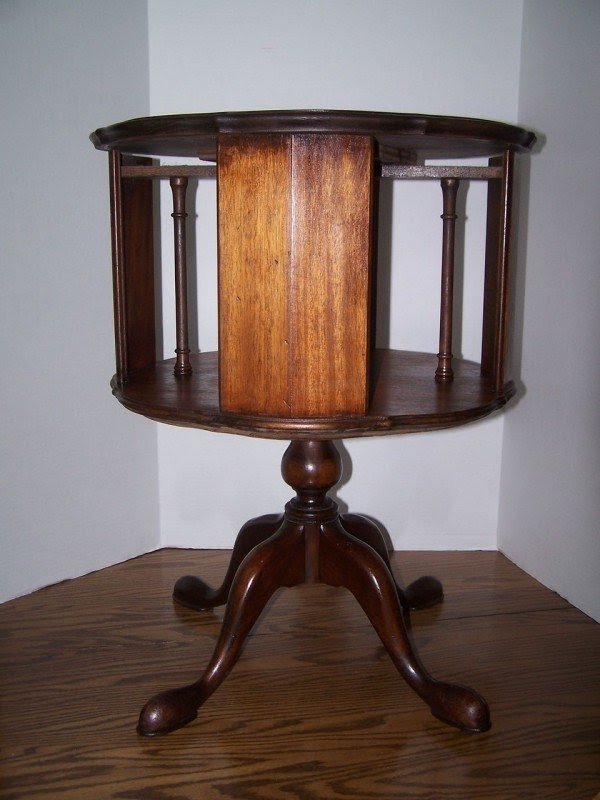 End table with slipper feet this is a walnut revolving