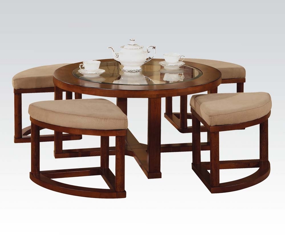 Coffee table with nesting ottomans