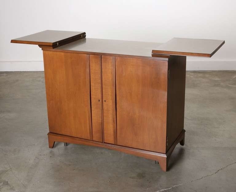 Mid century hide a way dry bar liquor cabinet image