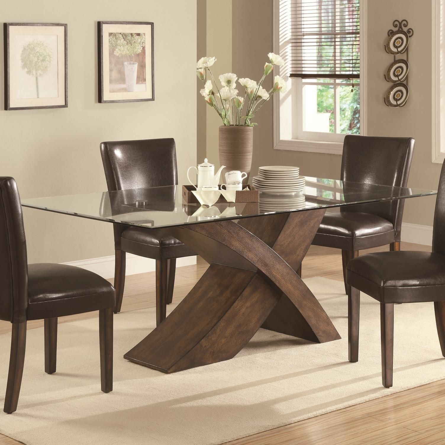 Glass dining table with wooden legs