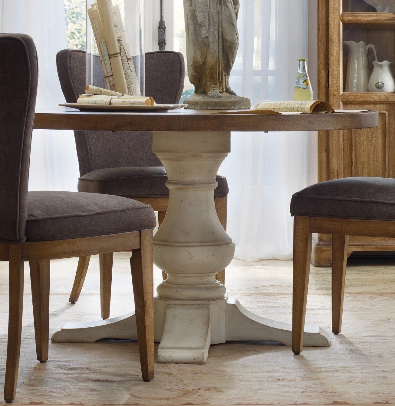 Whitewashed round dining table