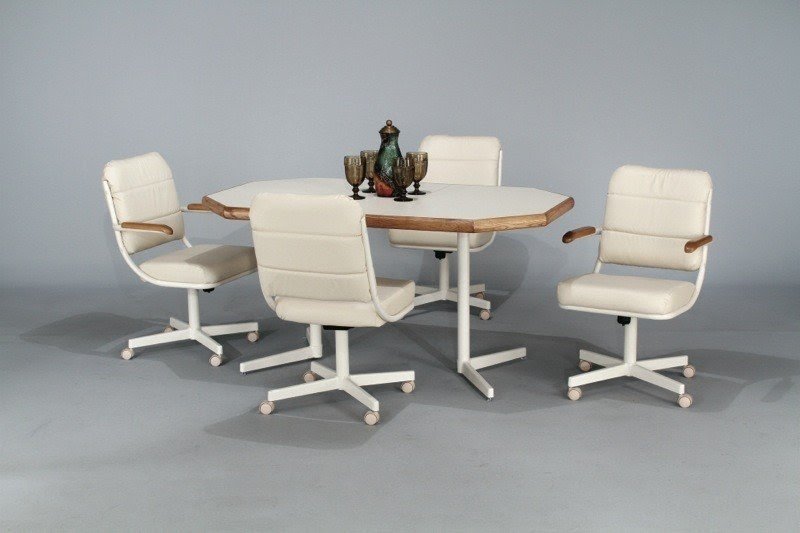 White simulated leather caster chairs and white laminate table