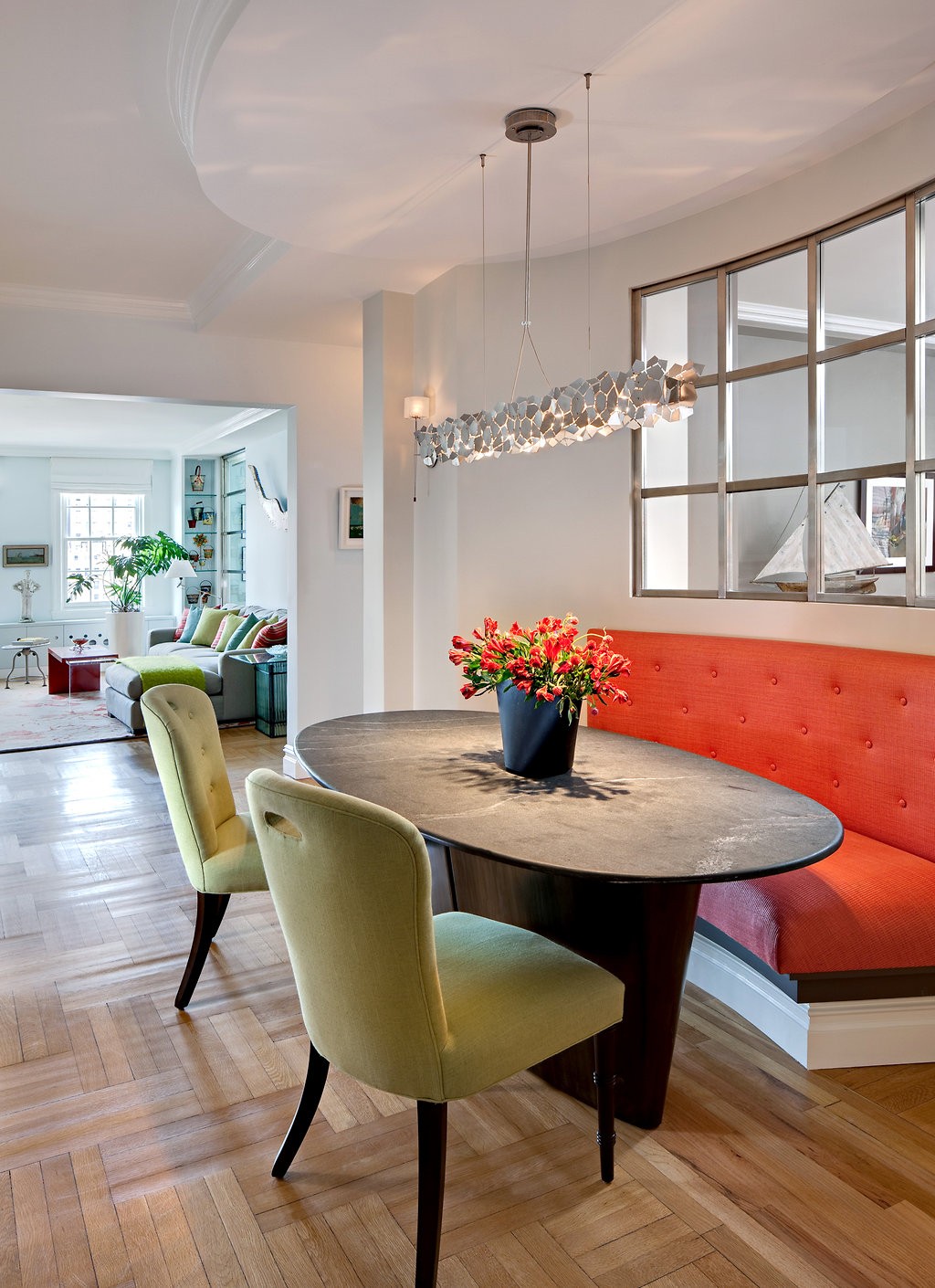 An interior window in the dining area lets light into