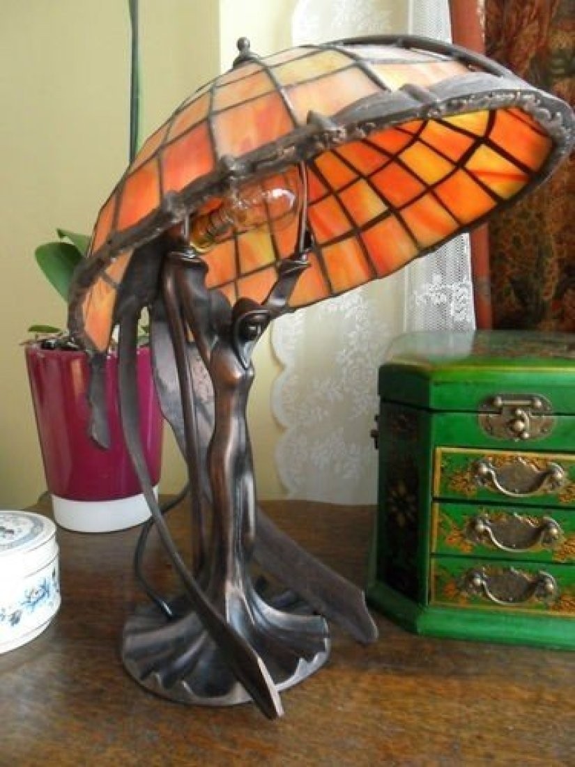 About art deco flying lady figurine tiffany stained glass table