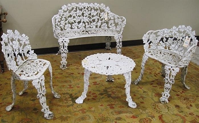 Lot 315 four piece cast iron garden furniture set settee