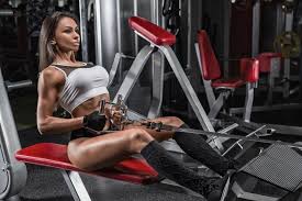 Sportive young woman in a gym training