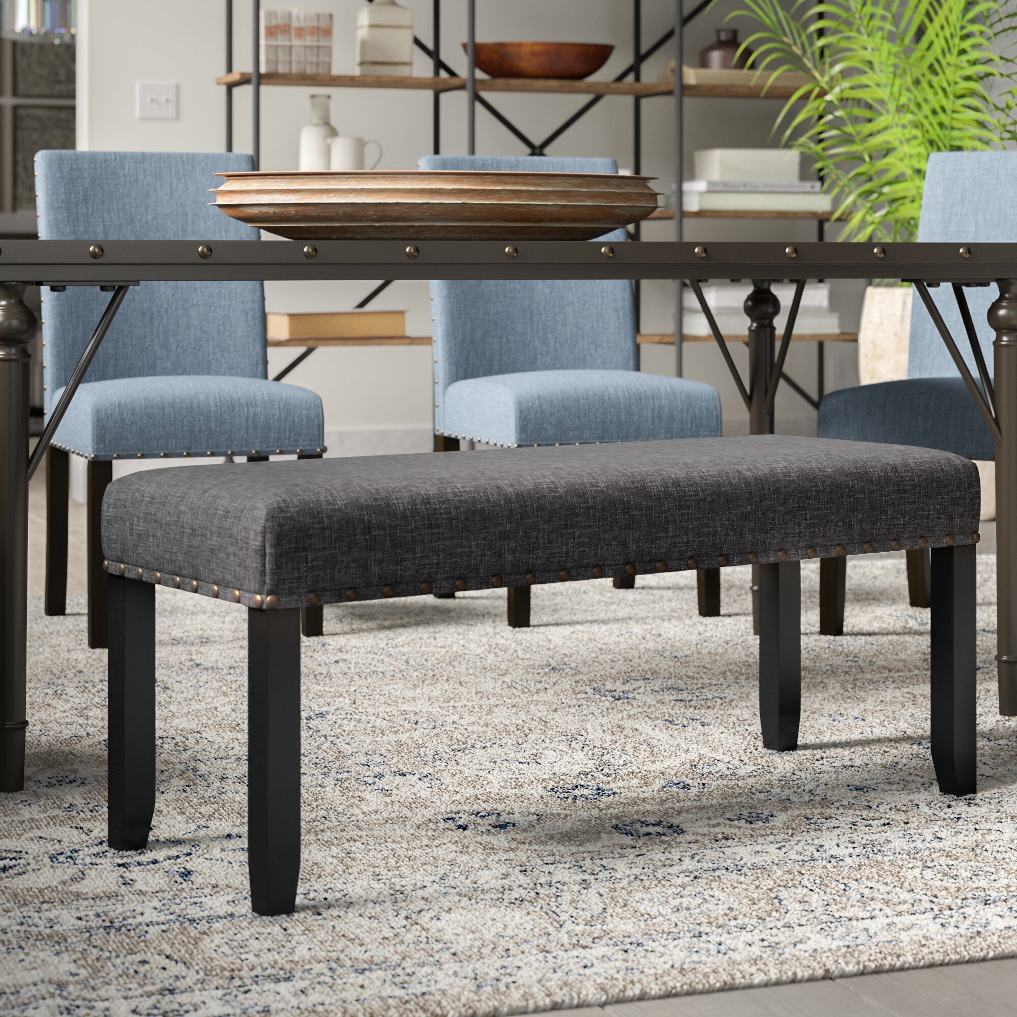 Upholstered bench with nailhead trim
