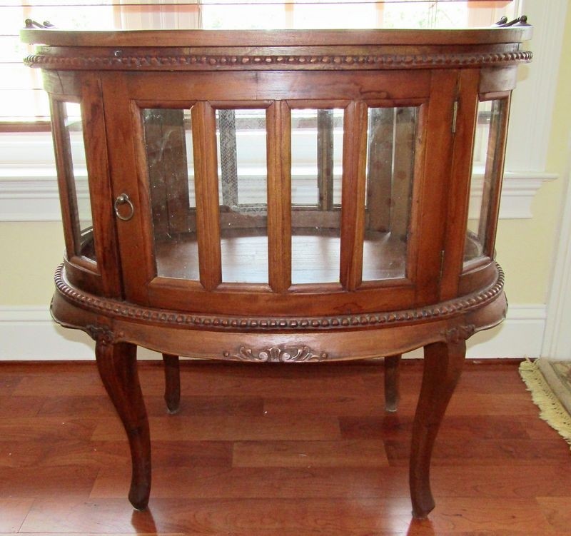 Antique oval curio cabinet with removable serving tray top
