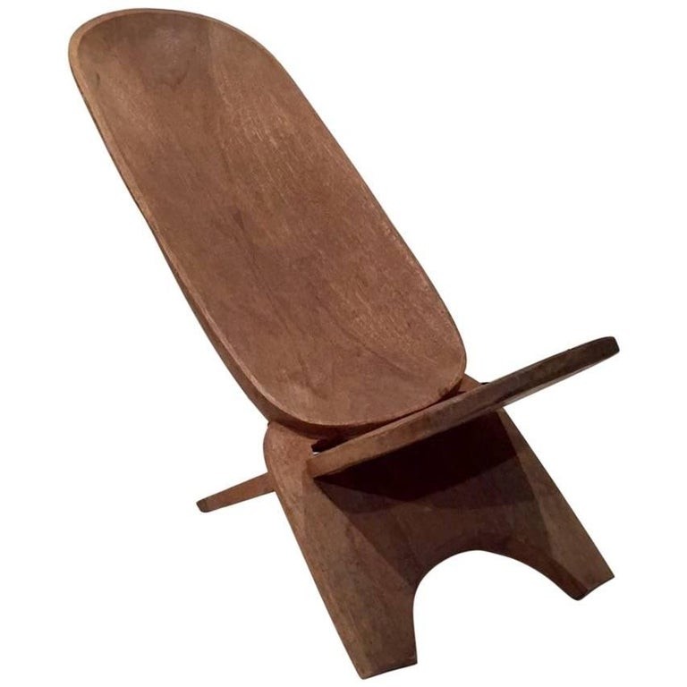 Tribal african lounge chair massive hand carded wood
