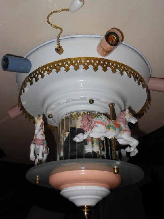 Revolving carousel horse ceiling light lamp mirrored by
