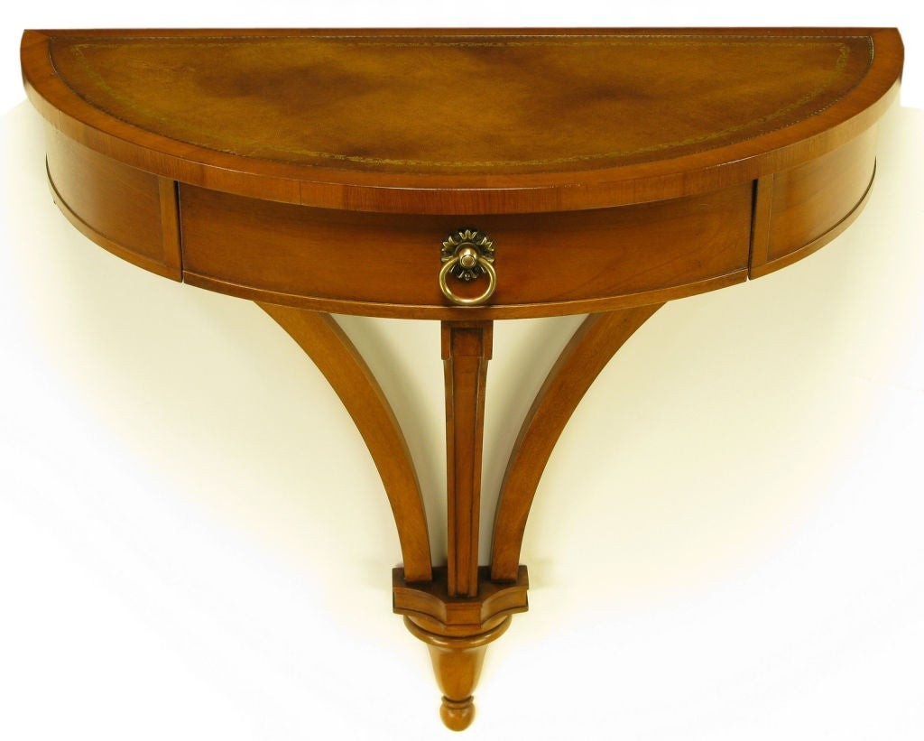 Wall mounted walnut demilune console table with leather top