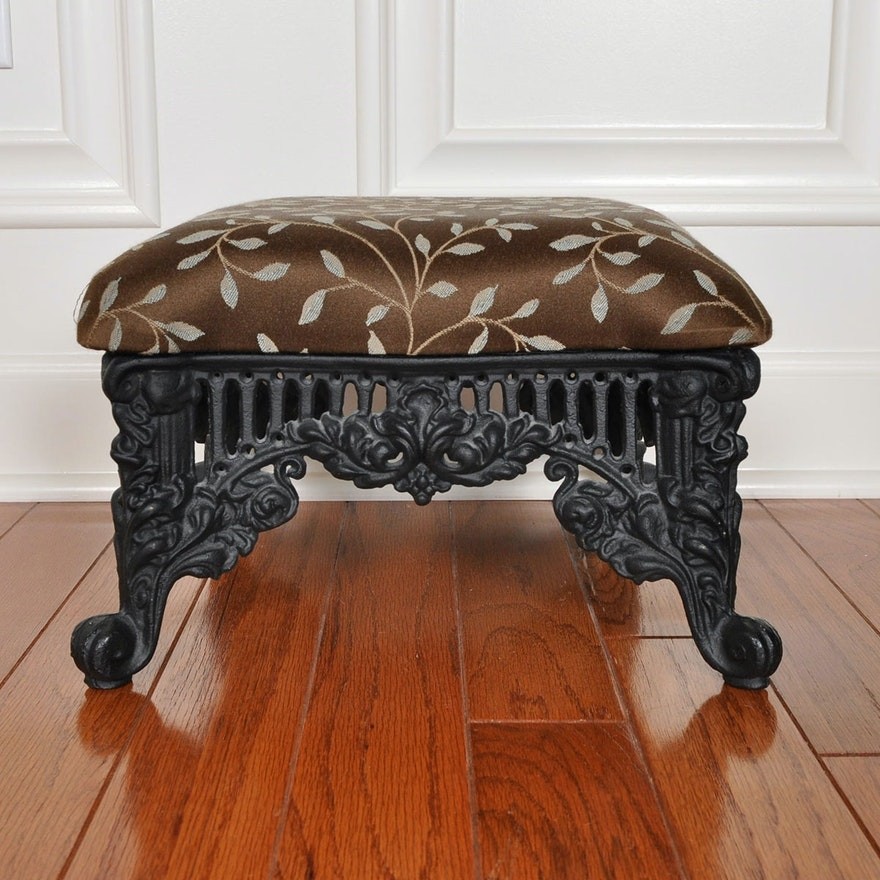 Antique cast iron footstool with upholstered cushion ebth
