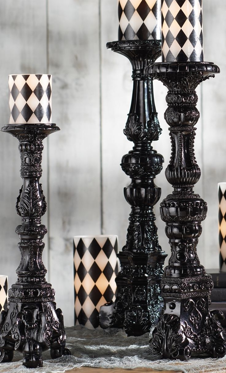 Elegant gothic black candle holders with patterned candles