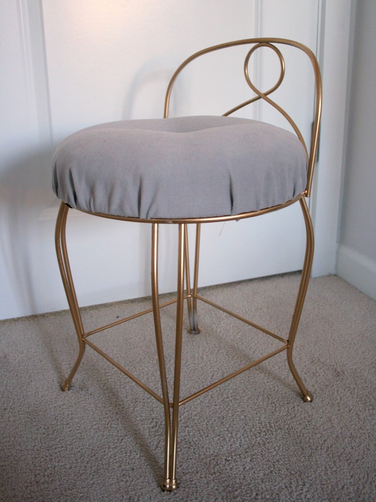 Elegant gold frame vanity stool with gray cushion