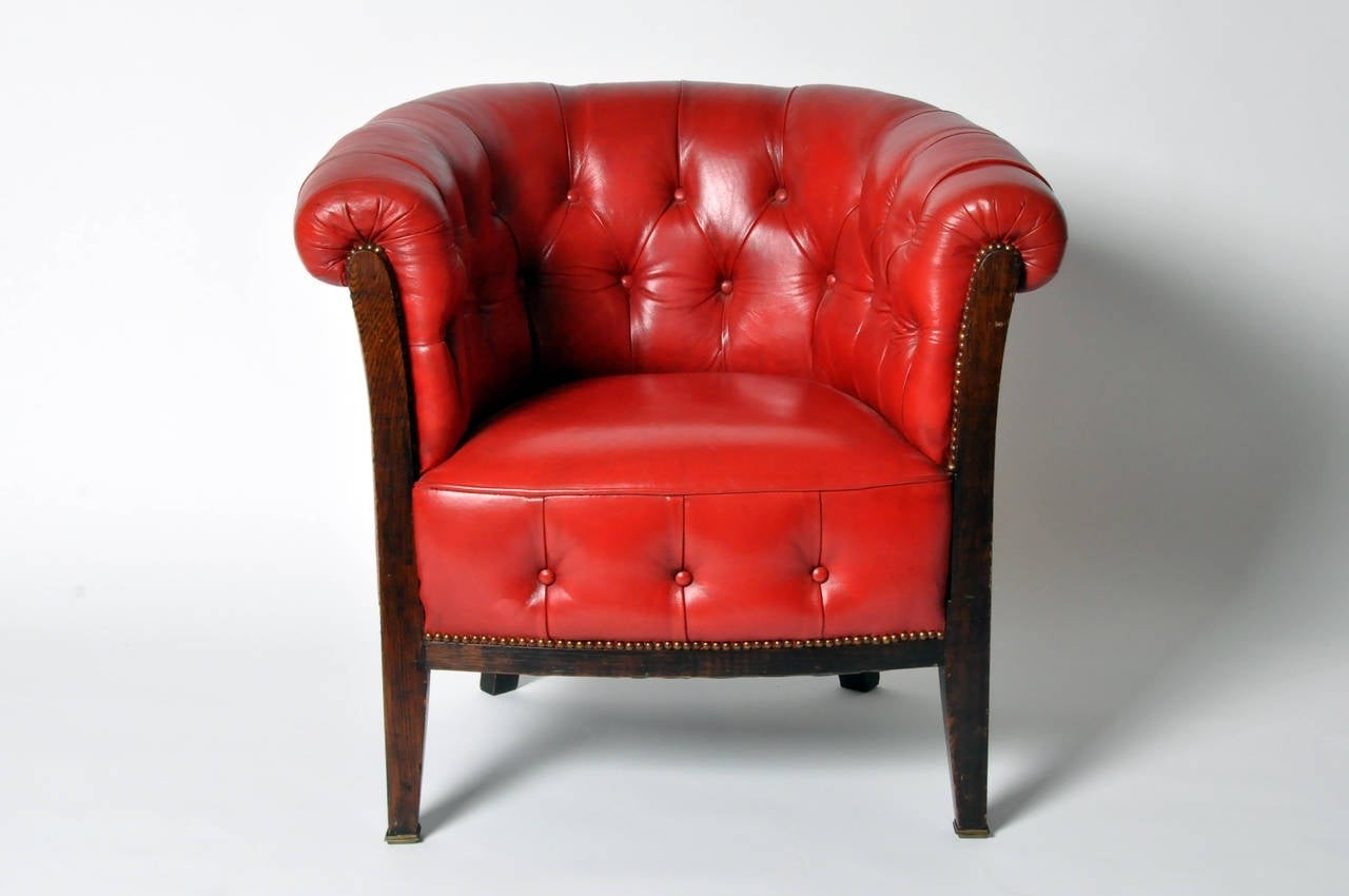 Vintage tufted red leather club chair