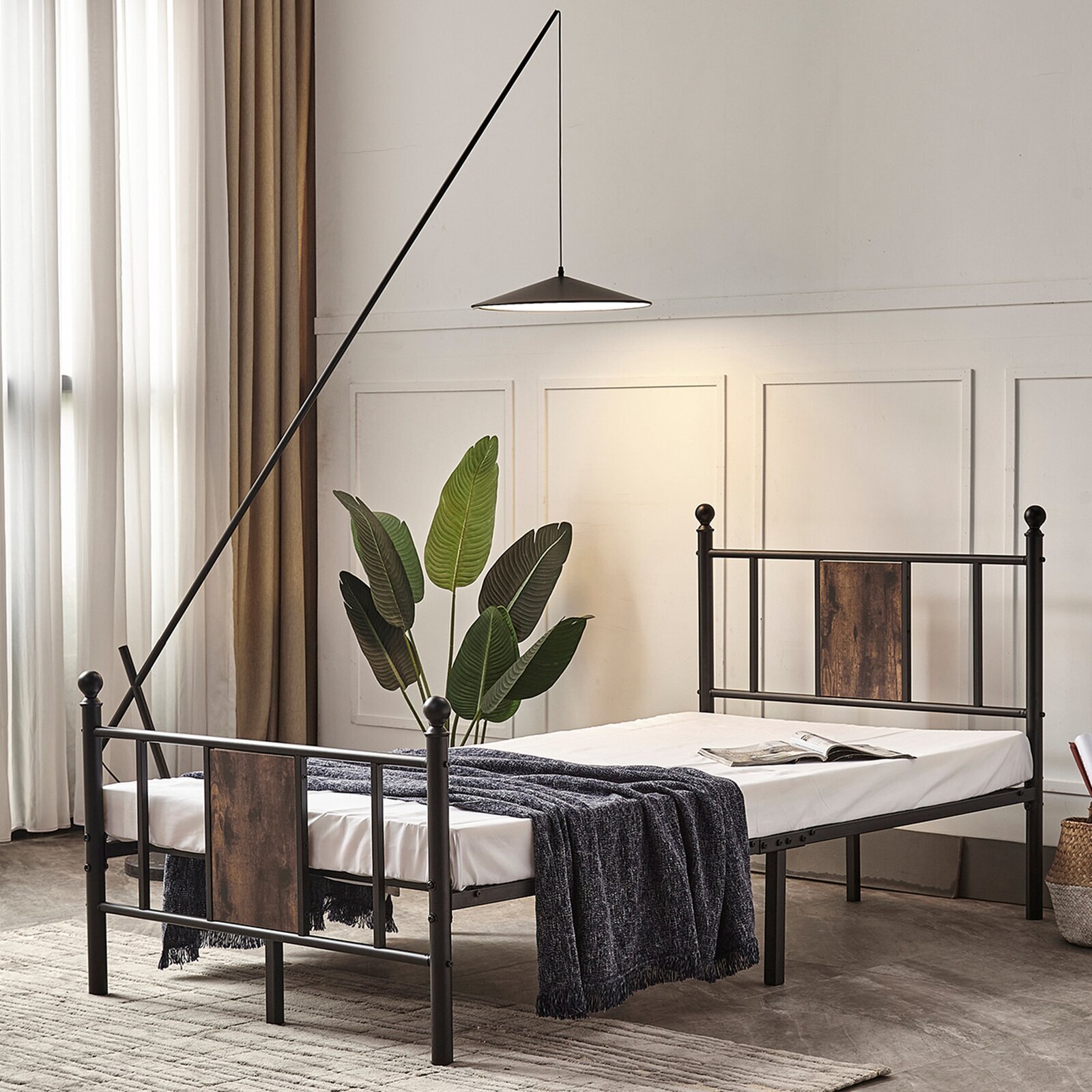 An iron bed frame with stained wooden inserts