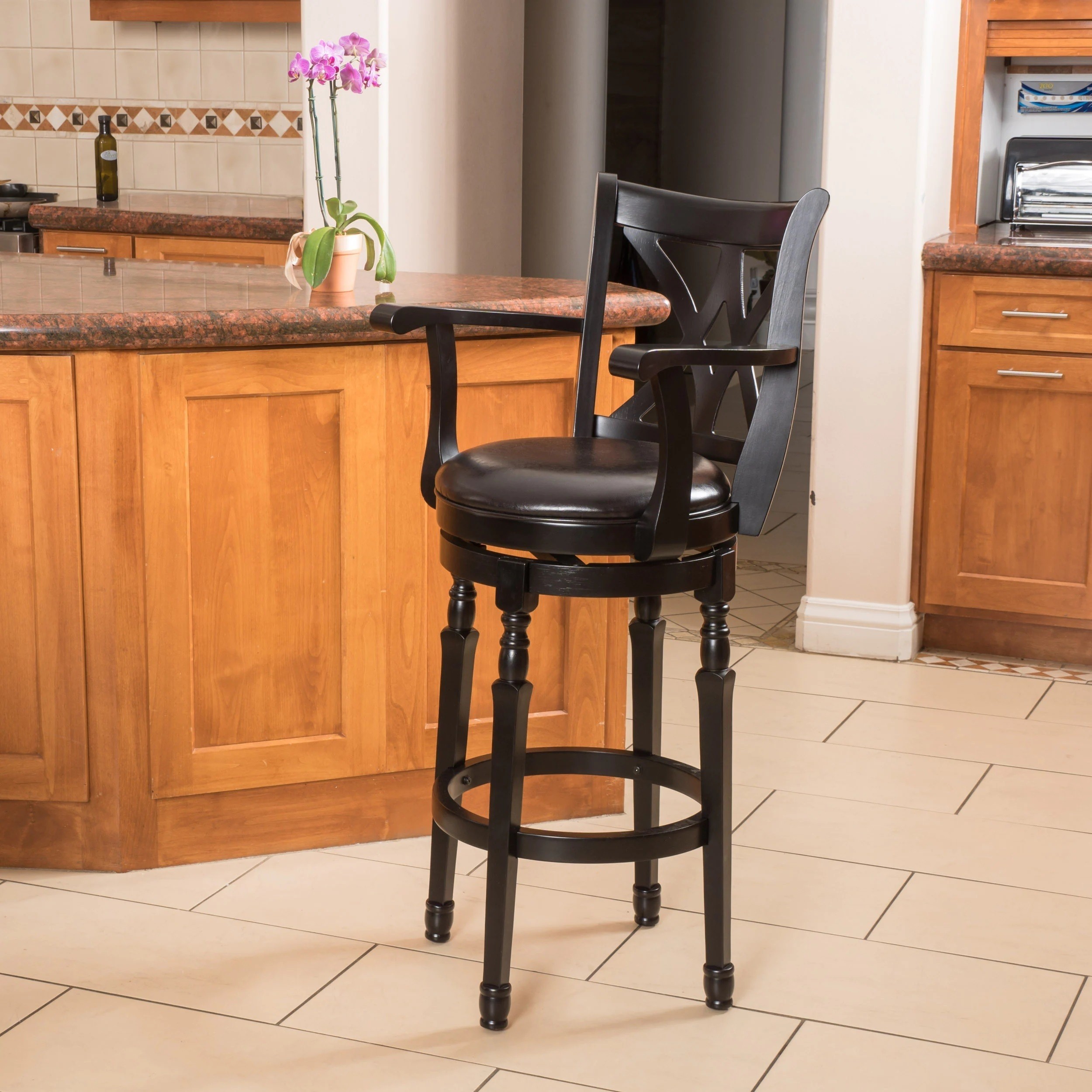 Carved wooden swivel bar stools with arms