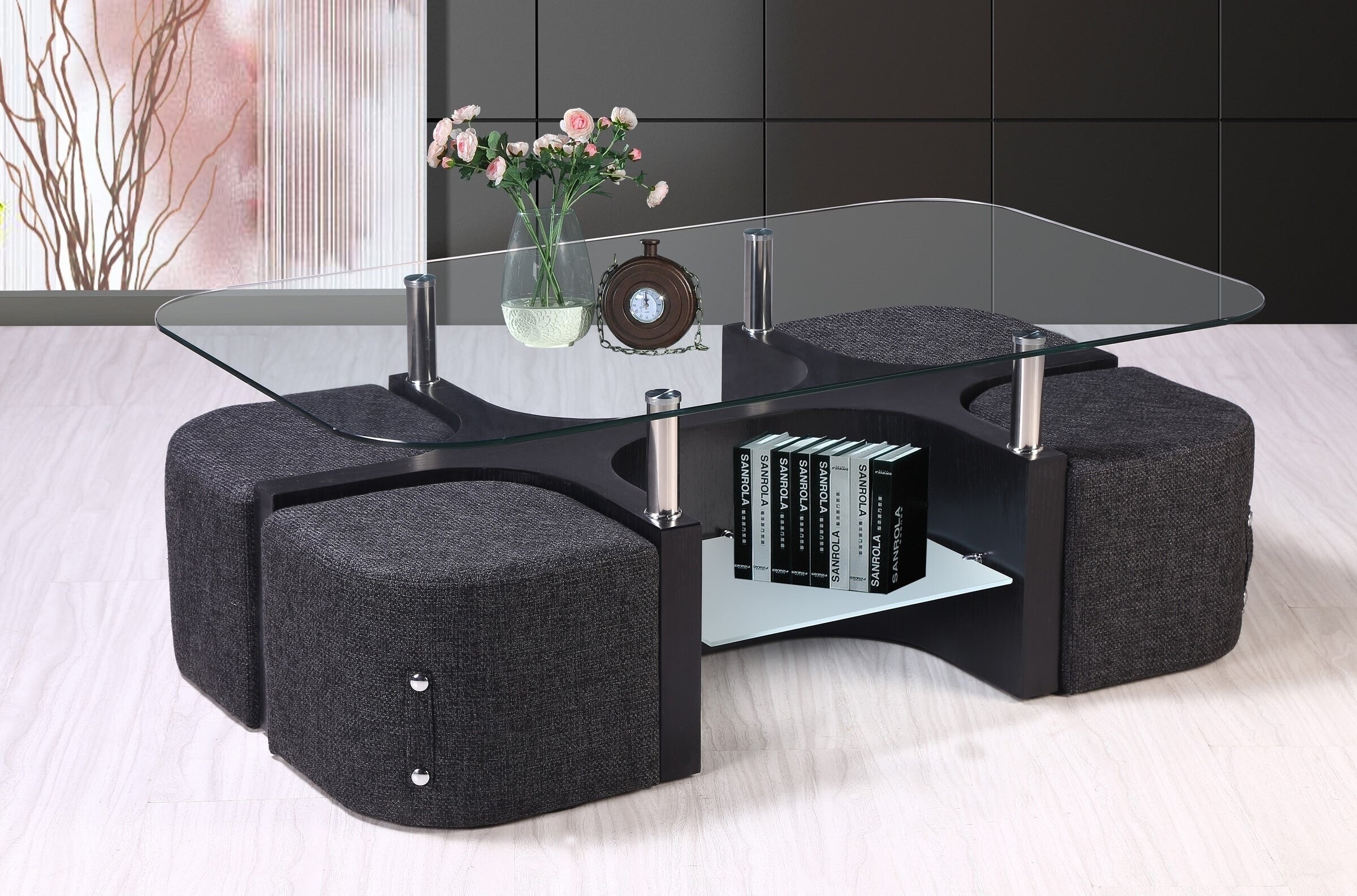 Glass rounded coffee table with chairs underneath 