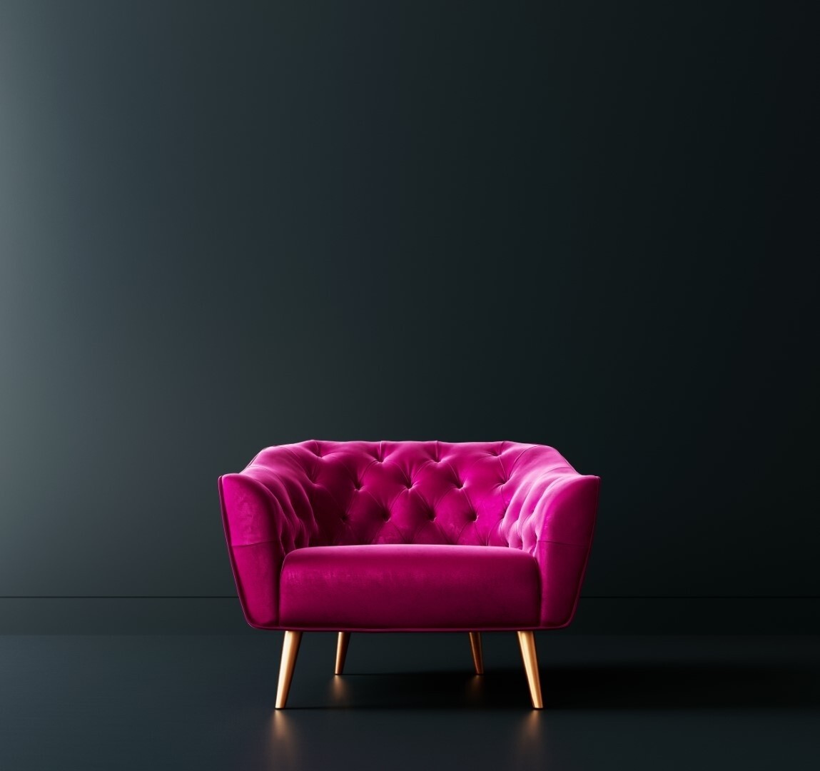 Pink armchair in black interior