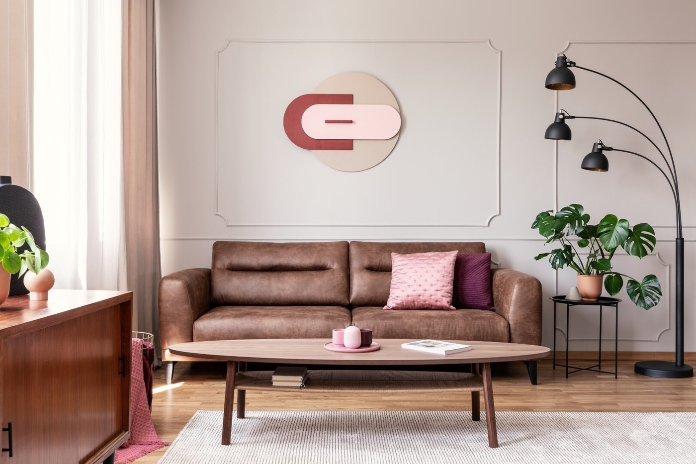 Pink Pillow On Leather Sofa