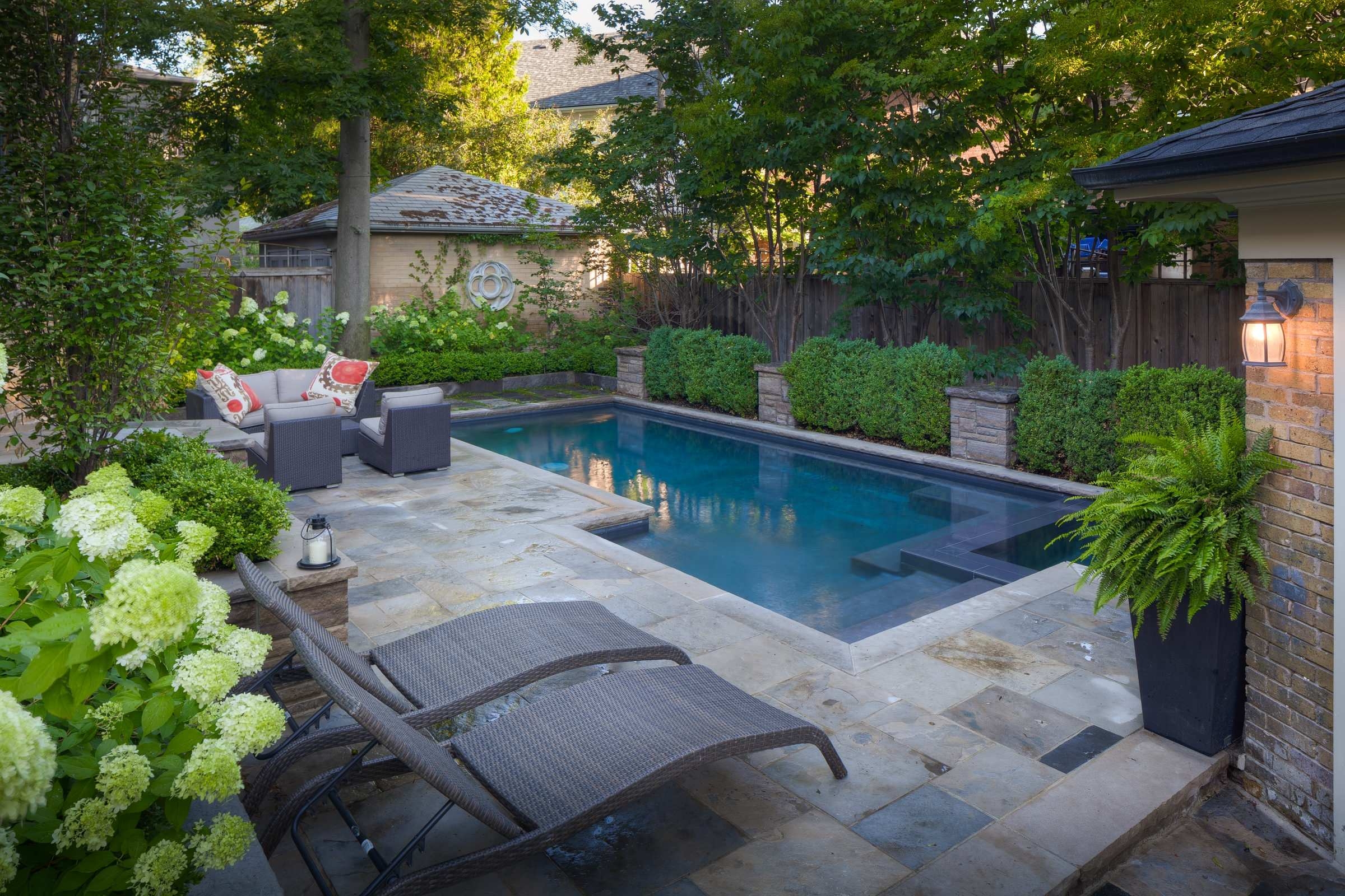 Rectangular pool with neutral chairs