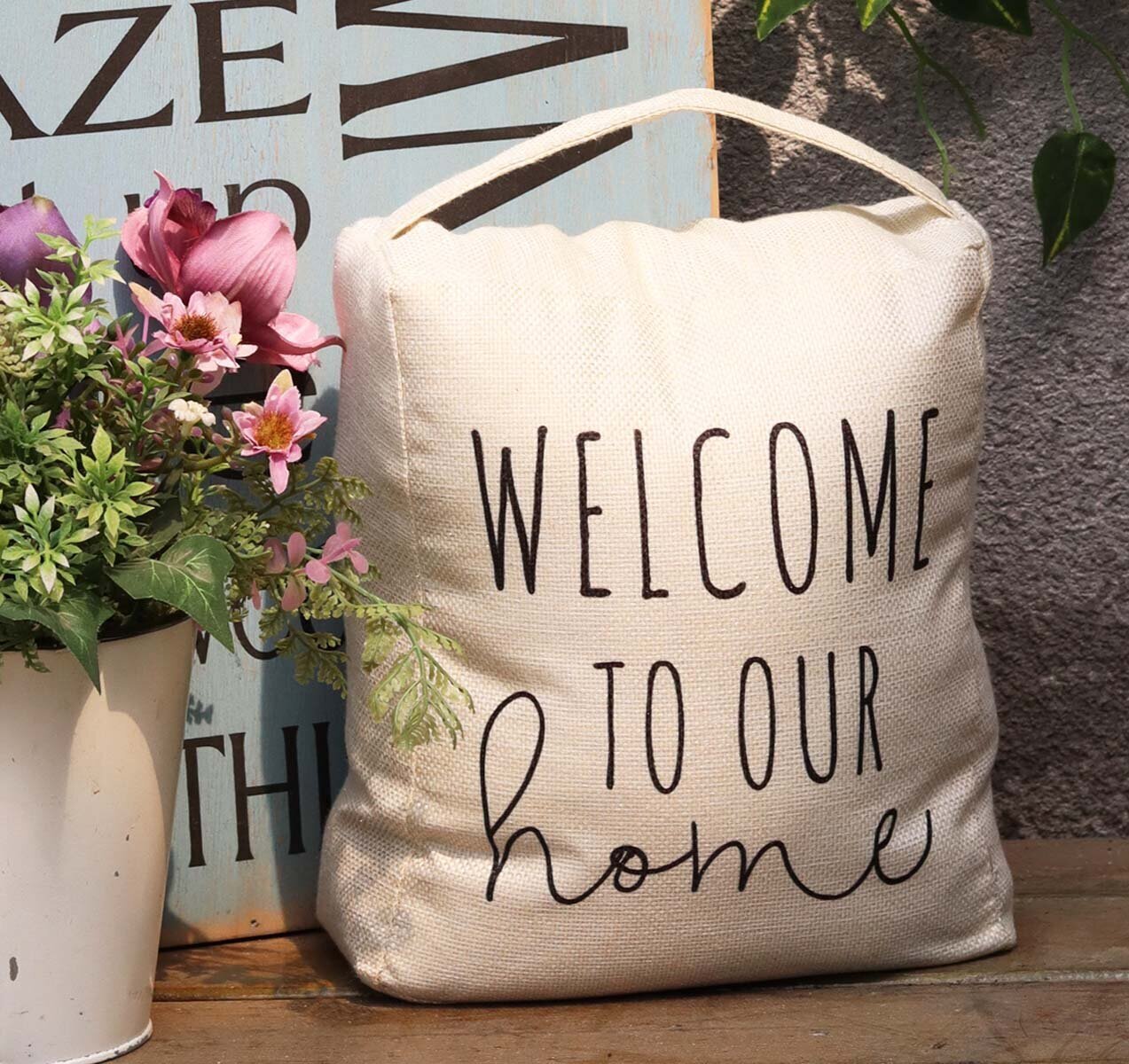 Unique door stop with a welcome sign