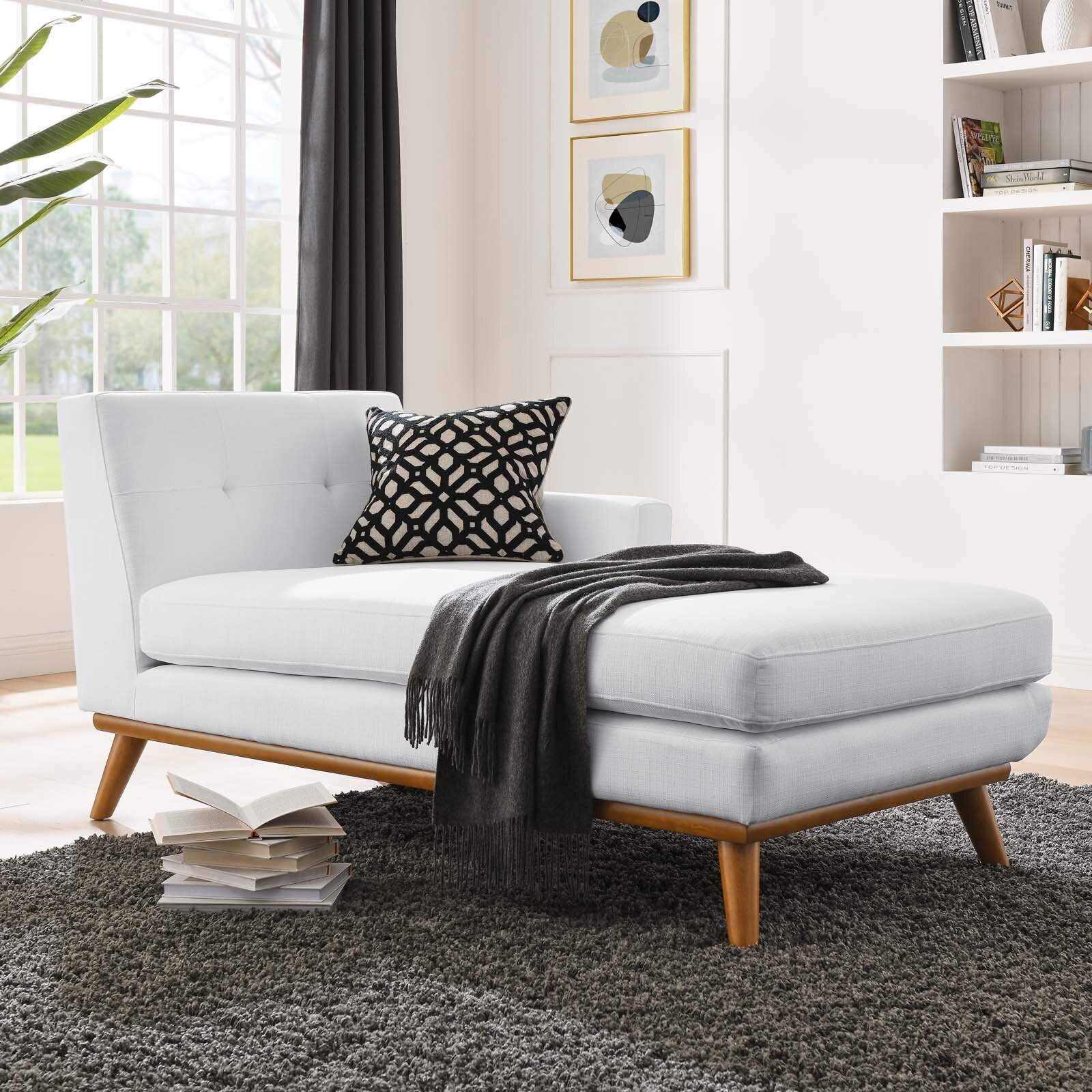White chaise lounge with mid century flair