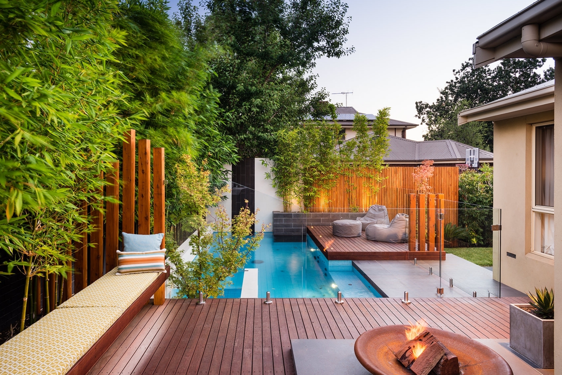 Wooden patio with a pool area