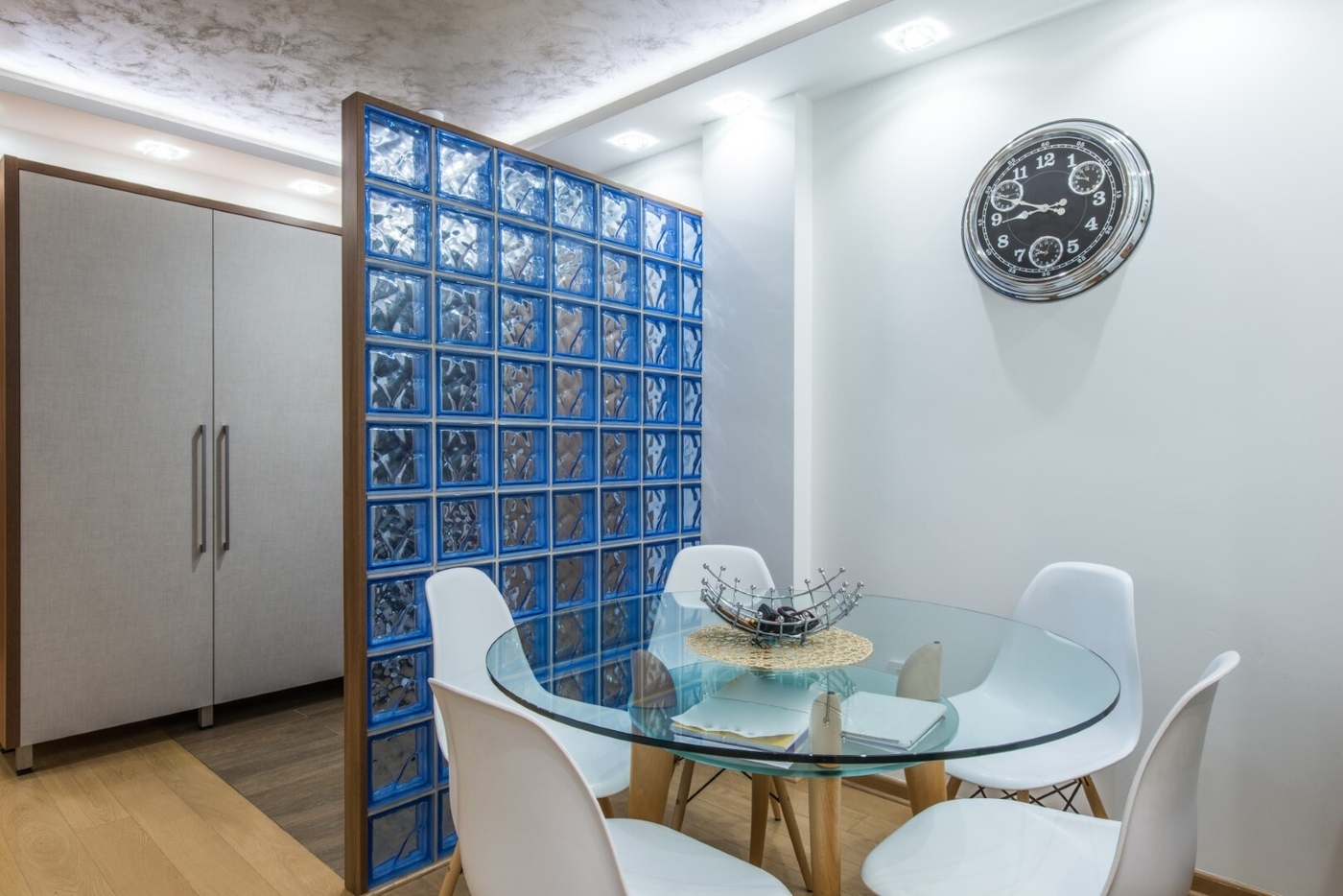 Glass table and white modern chairs